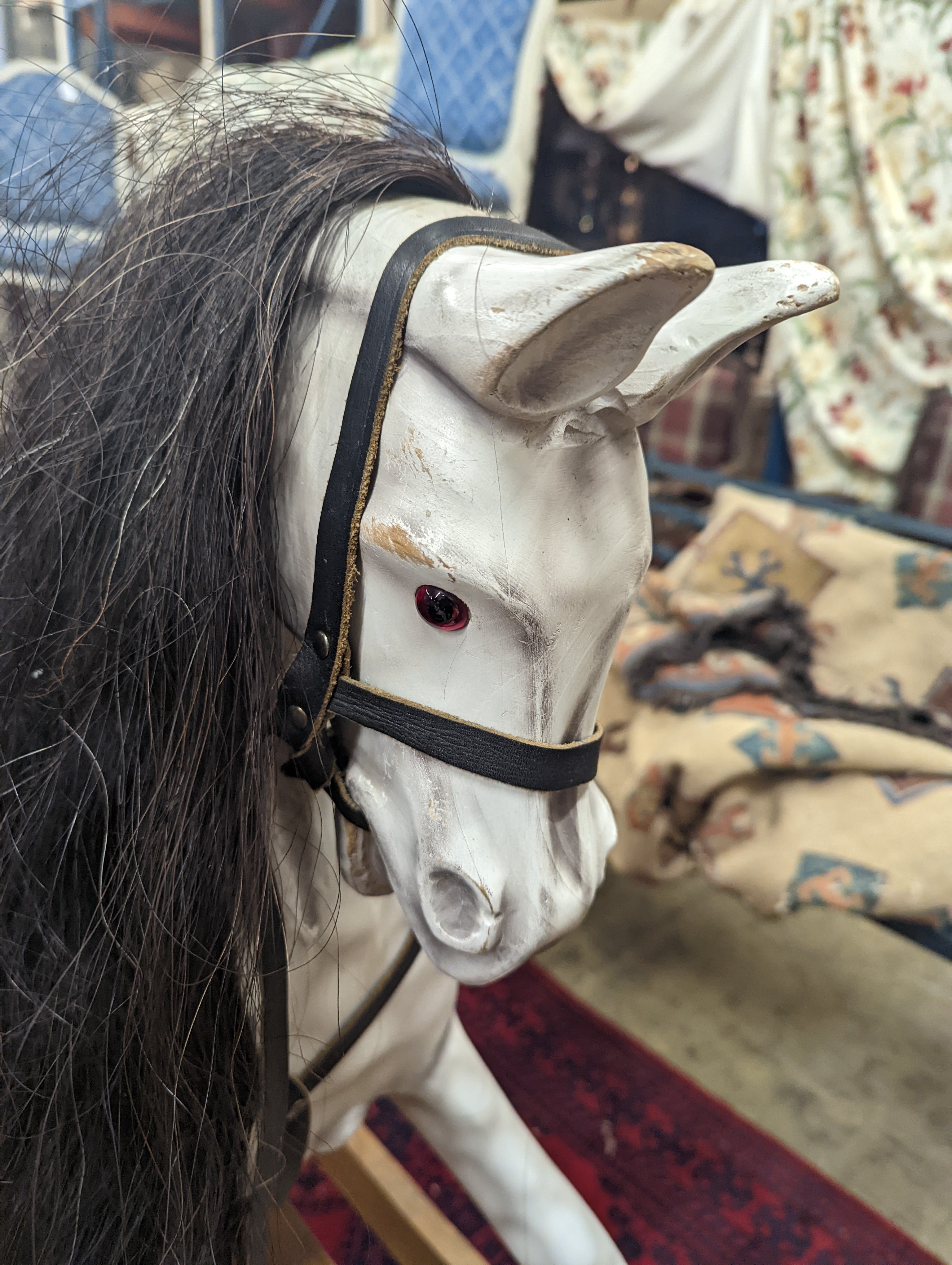 A Victorian style dapple grey rocking horse on pine stand, length 152cm, height 126cm